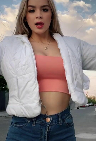 Hottie Carol Castro Shows Cleavage in Peach Crop Top