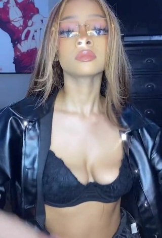 Luscious Caeli Shows Cleavage in Black Bra