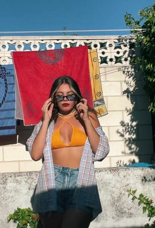 Sultry Claudia García in Orange Bikini Top